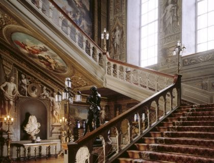 Partial view of the Grand Staircase, showing Laguerre murals at Petworth House, West Sussex